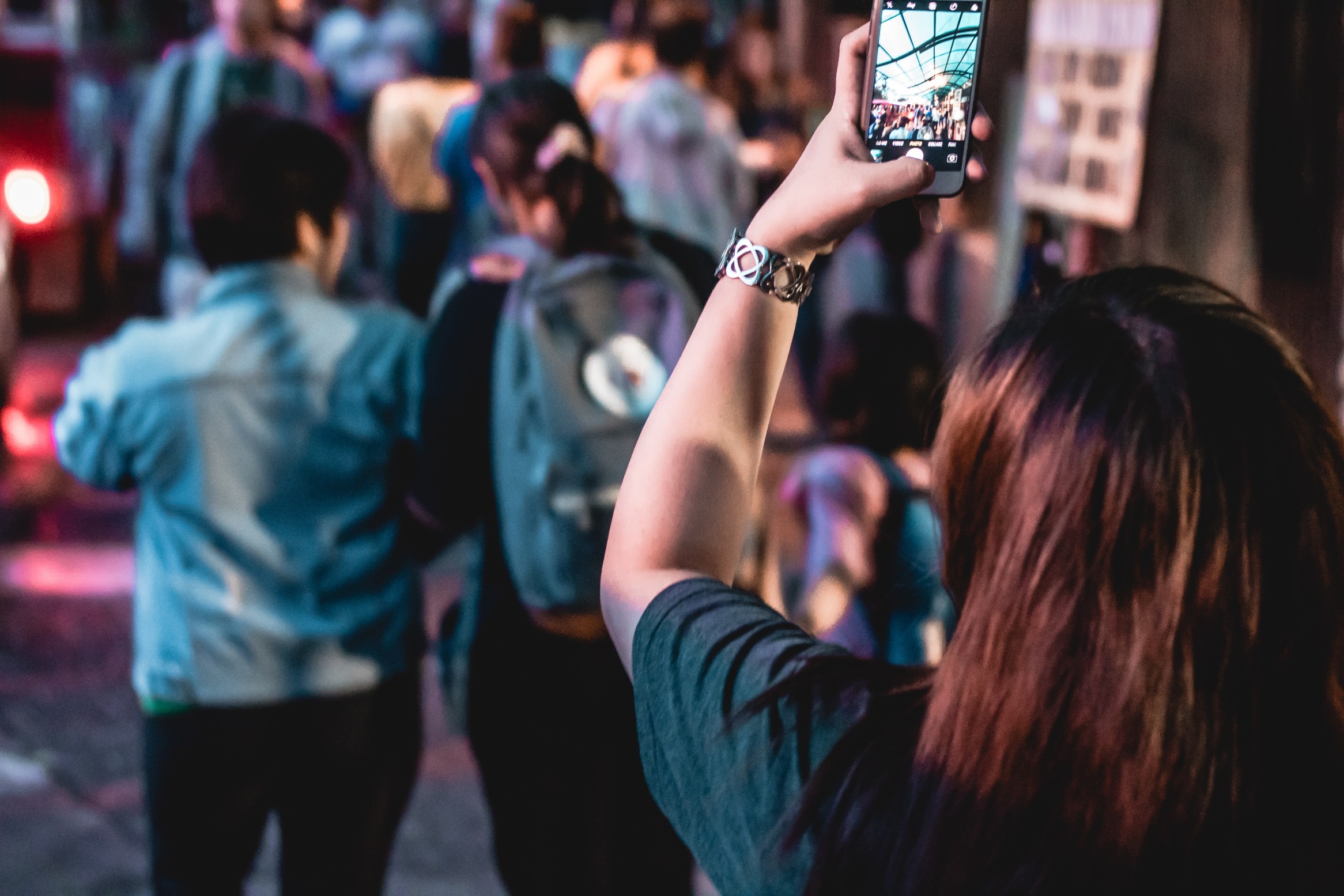 Woman, smartphone, video recording