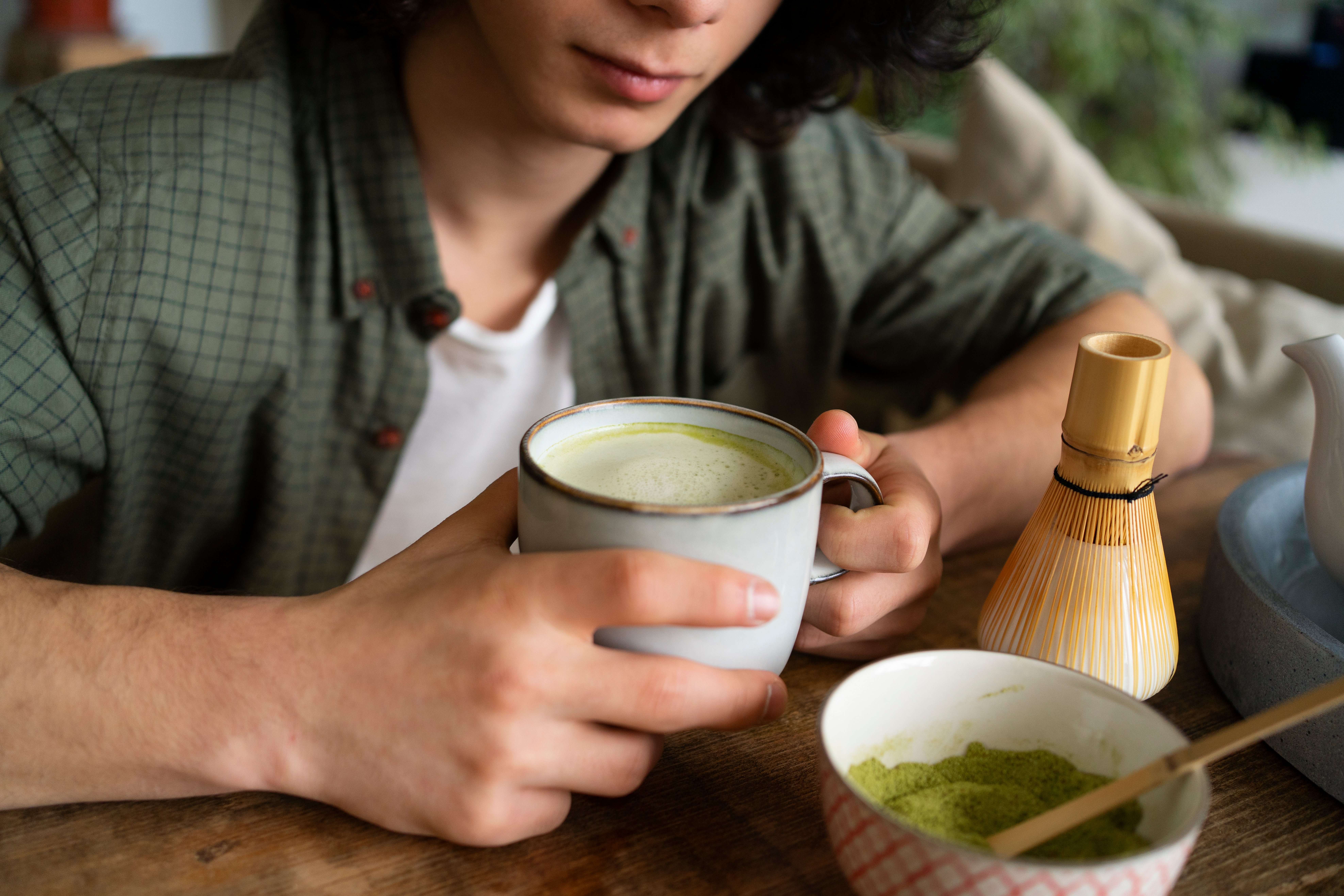 man-enjoying-cup-matcha-tea